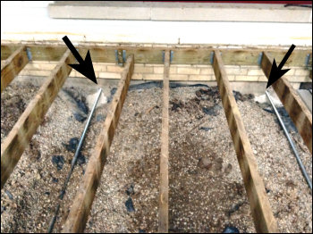 Image of Decking Removed to Accomplish Tilted Wall Repair Using Reinforcing Rods